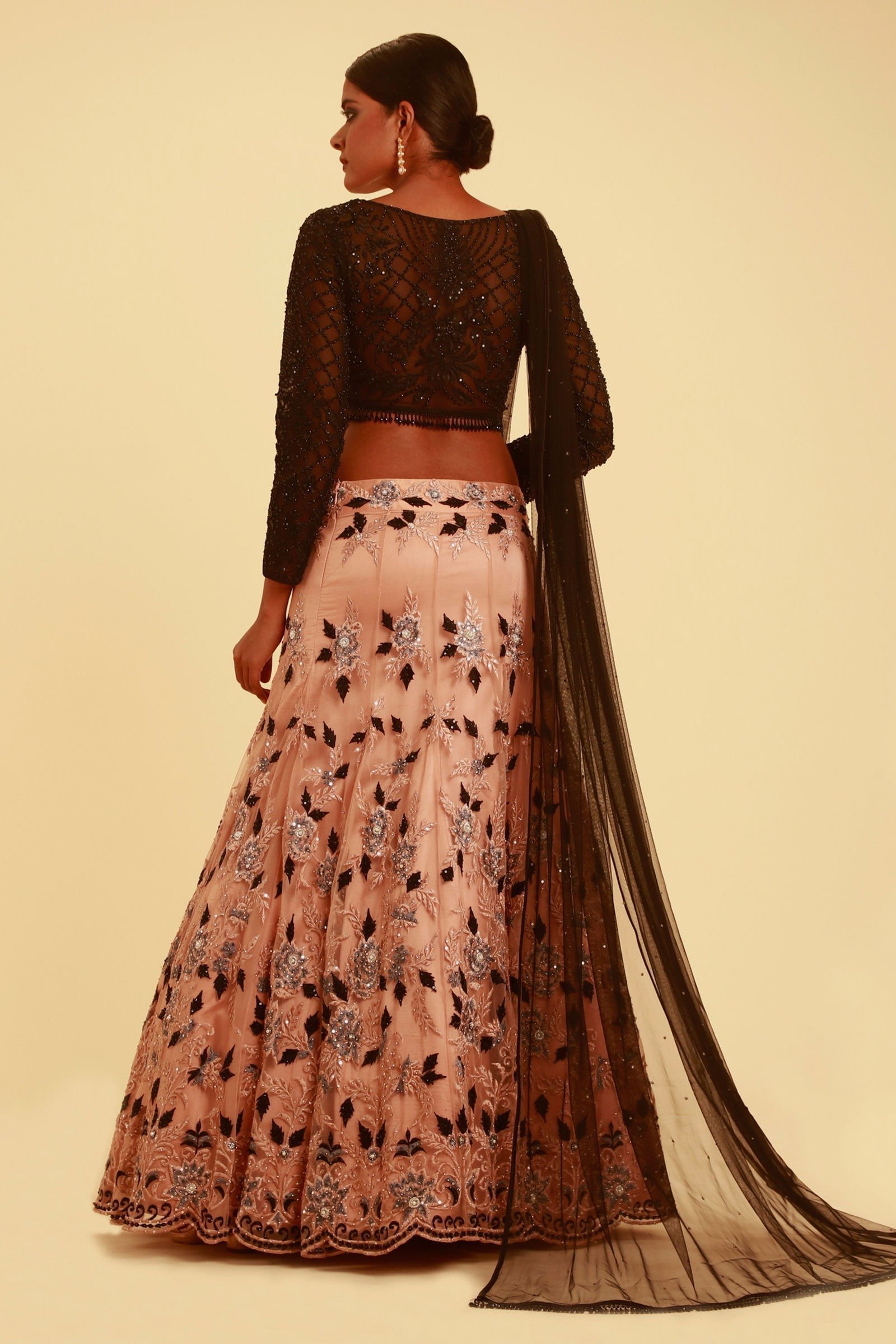 NUDE PINK LEHENGA WITH FLORAL DETAILS AND CONTRAST BLACK TASSELED CHOLI - Image 3